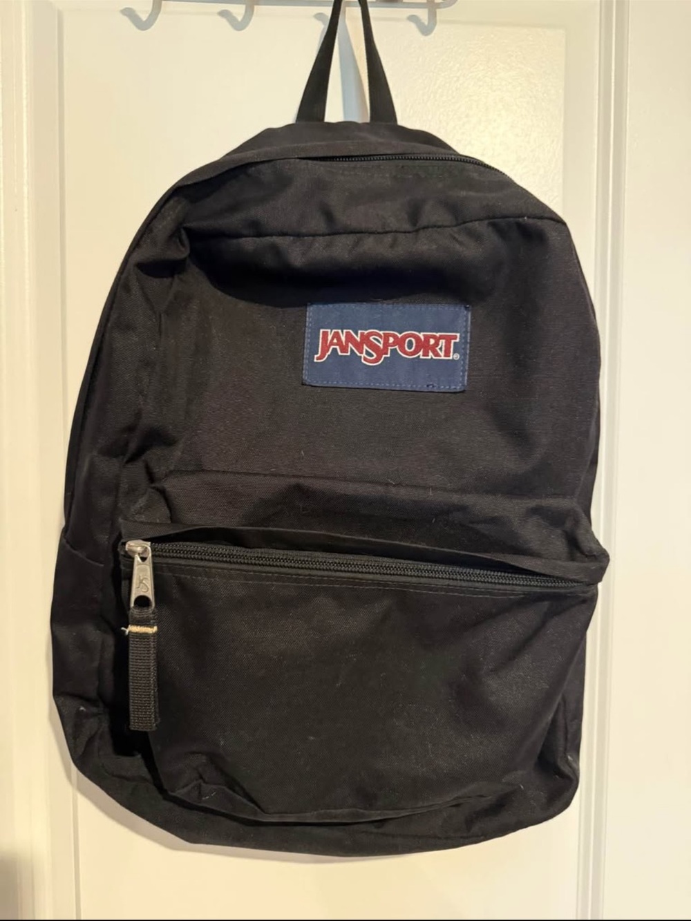 Jansport Black Backpack with Navy Patch and Red Logo
